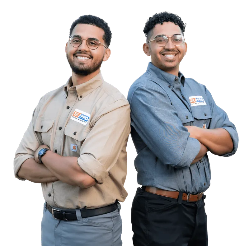 JX Pro Heating and Cooling technicians in branded uniforms